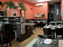 Among Vee Vee’s charms are its boldly colored walls (Benjamin Moore’s “Autumn Cover”), a signature touch for co-owner Kristen Valachovic, an interior designer before restaurant life took hold.  
