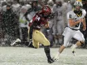With wet snow veiling the Stadium's FieldTurf surface, tailback Treavor Scales '13 had his best game of the season against Dartmouth, rushing for 139 yards and two touchdowns. Cornerback Shawn Abuhoff is the Big Green defender.