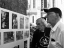 Peter Winship (left) and Bill Christian examine photographs recalling their days as student researchers in the village of Chanzeaux, under the tutelage of the late Laurence Wylie.
