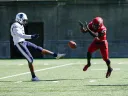  Harvard freshman Khalil Dawsey blocks the punt of Howard's Isaiah Moore.