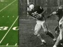 Ric Zimmerman leans forward with football in hand