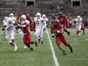 Running back Aidan Borguet runs up field with ball in hand