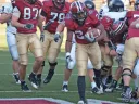 Junior tailback Treavor Scales was Harvard's top ground-gainer against Pennsylvania. His 70 yards rushing included a 35-yard breakaway, setting up a two-yard touchdown run (above) at the start of the final quarter. The Penn defender is linebacker Erik Rask.