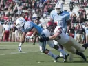 Strong defensive play held Columbia’s ground game to a net 49 yards rushing. Above, senior linebacker Matt Martindale (45) hauls down tailback Alan Watson. Martindale finished the game with five tackles and a quarterback sack.