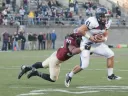 In the final minute of play, safety Jaron Wilson stopped Penn halfback Kyle Wilcox at the Harvard 20-yard line after a one-yard gain on a swing pass. Holding off three final passing attempts, the Crimson defense quashed the Quakers’ late bid for a game-tying rally.  