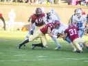 Not going anywhere? Columbia's Turner DeMuth ran into a posse of Harvard tacklers, including linebacker Eric Medes ’16 (number 49), defensive back Scott Peters ’16 (44), defensive back Jordan Becerra ’16 (31) and linebacker Chase Guillory ’18 (45).
