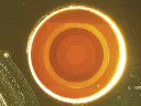 This disortion-free flat lens, less than a millimeter across, uses antennae etched from a layer of gold, rather than glass, to focus laser light. 