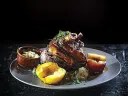 Bronwyn is a great place to hunker down for a wintry meal of sausages, beer, <i>pierogi,</i> and the &ldquo;giant pork knuckle.&rdquo; (pictured)