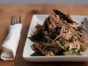 An appetizer of ground pork with onions and basil