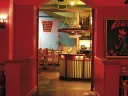 Rich colors and paintings by Latin American artists add to Merengue’s vibrancy. 